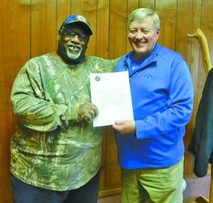 Julius Maurice Johnson, left, poses with fellow veteran, Hot Springs Mayor George Kotti, while holding a letter showing the city’s endorsement of Johnson’s “Casting Vets” program.